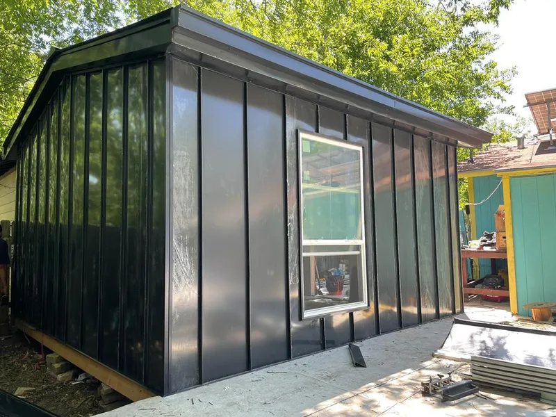 Black standing seam metal wall panels for Roof Inspection in Brewer