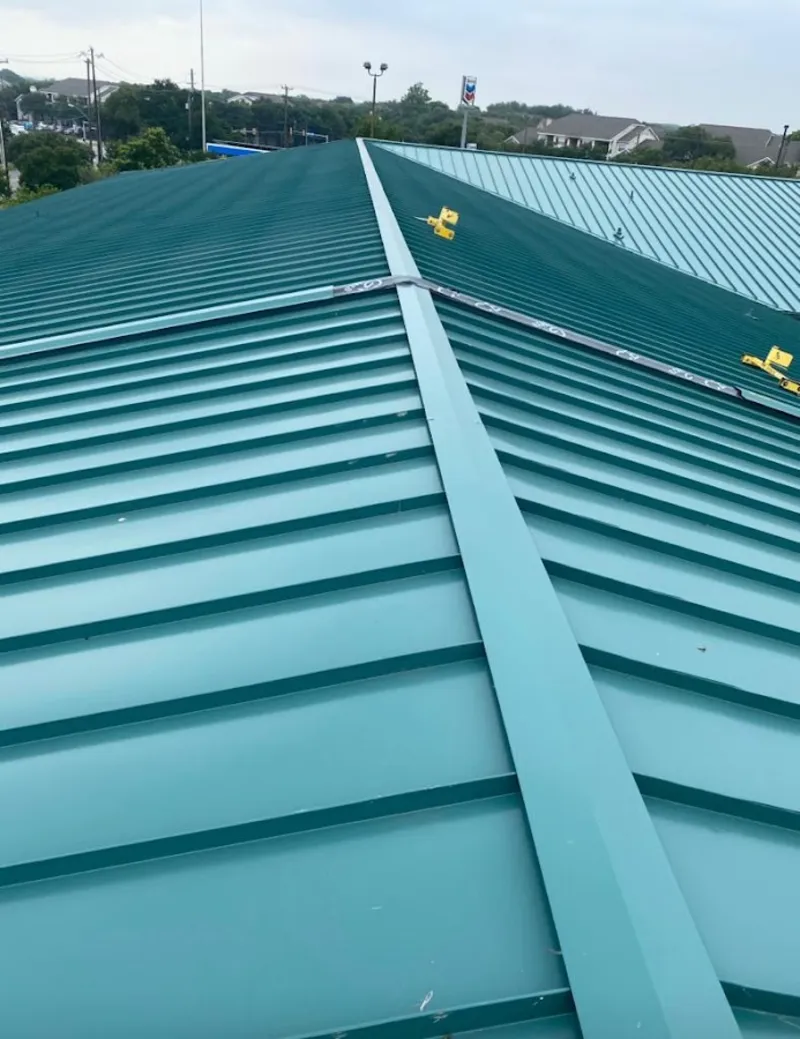 Green commercial metal roof ridge and valley for Metal Roof Repair in Brewer
